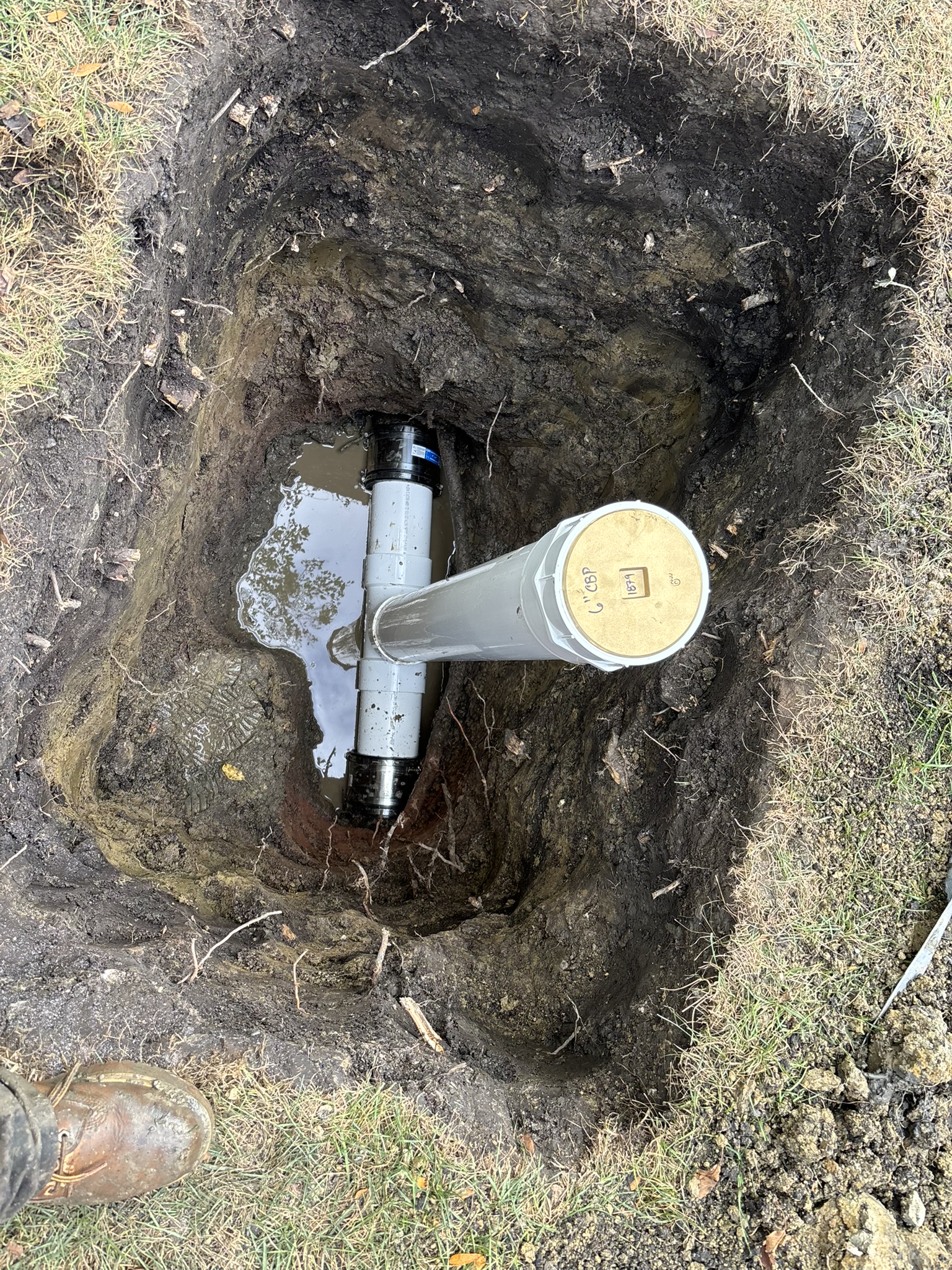 New Chicago sewer cleanout tied back into the main line with rubber couplings