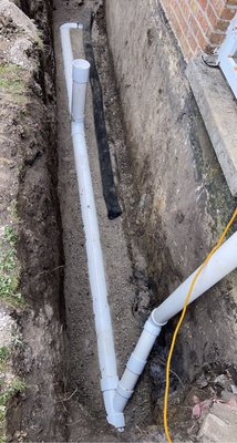 Catch basin being rebuilt with brick surround at a Chicago property