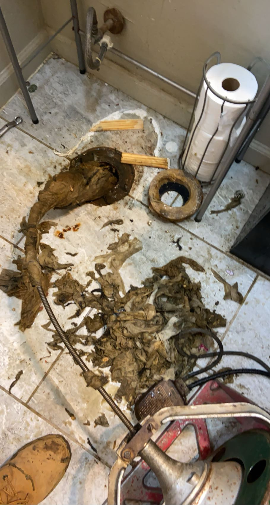 Wet wipes and tree roots pulled from a Chicago sewer line by a Spartan rodding machine